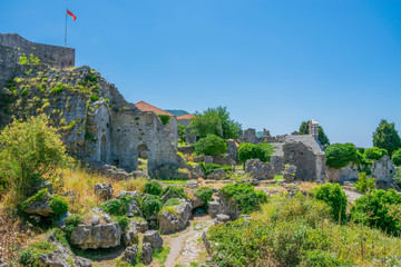 Wall Mural - Medieval stone fortress is located high in the mountains.