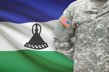 American soldier with flag on background - Lesotho