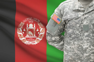 American soldier with flag on background - Afghanistan