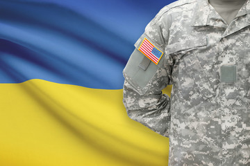 American soldier with flag on background - Ukraine