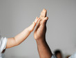 © Rawpixel.com - Small and big hands doing a high five