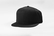 © DendraCreative - Black snapback hat cap flat visor isolated on white background.