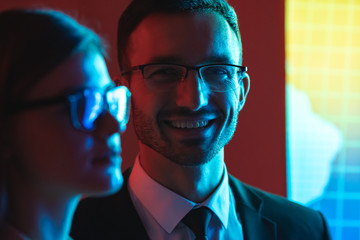 Poster - The happy man and a woman standing near the screen