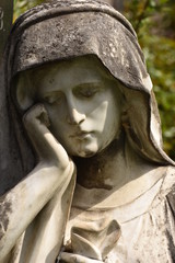  BISTRITA,  ROMANIA,  2016 ,Stone statue of a  woman. statue in cemetery