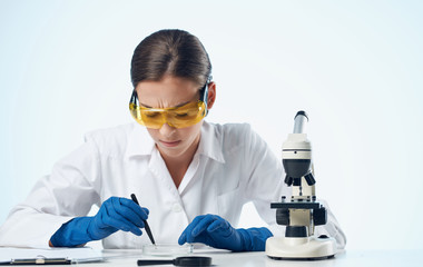 scientist in laboratory with test tubes