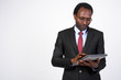 © Ranta Images - Portrait of handsome African businessman using digital tablet