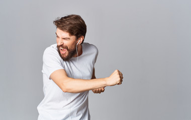 man singing songs listening to music on headphones