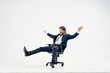 © SHOTPRIME STUDIO - business man riding his chair on an isolated background