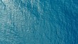 © simanlaci - aerial drone image of the deep blue clear sea ocean water with small waves rolling