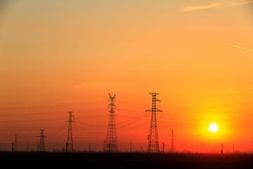 Wall Mural - High piezoelectric towers, in the setting sun