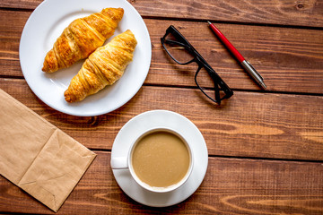 Business breakfast with coffee and croussant top view