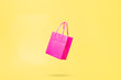 Flying Shop Bag Store Sale Concept Pink and Yellow Color