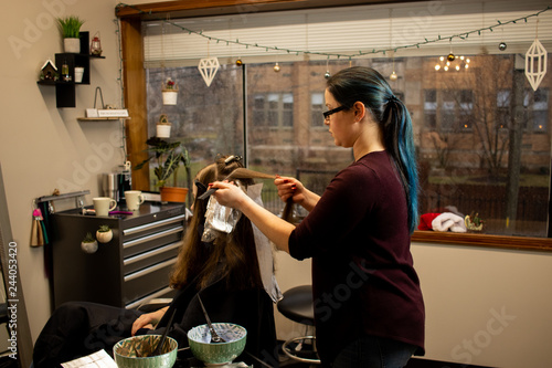 Hair Color Application By A Young Female Hair Stylist In A Salon