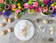 Table decoration colorful spring flowers Easter eggs