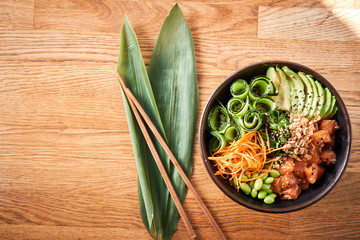 Wall Mural - Poke bowl on wooden background