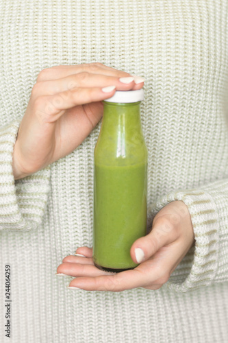 Winter seasonal smoothie drink detox. Girl in a woolen sweater ...