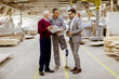 © BGStock72 - Three men standing and discuss in furniture factory