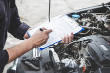 Services Car Engine Machine Concept, Automobile Mechanic Repairman Checking A Car Engine With Inspecting Writing To The Clipboard The Checklist For Repair Machine, Car Service And Maintenance