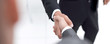 © ASDF - Cropped image of business people shaking hands