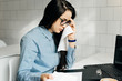 © mnelen.com - tired busy girl freelancer with glasses working for a laptop in a cafe