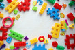 Children's toys and accessories on a white background. View from above