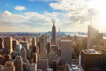 New York City skyline from roof top with urban skyscrapers before sunset. New York, USA.