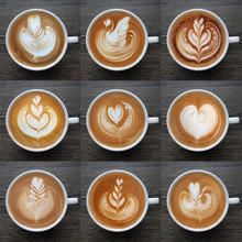 Collection of top view of latte art coffee mugs on timber background.