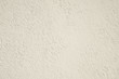 roughcast plaster wall background texture in off-white