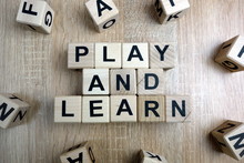 Play And Learn Text From Wooden Blocks On Desk