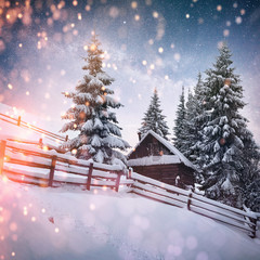 Wall Mural - magical winter snow covered trees and mountain village. Winter landscape. Vibrant night sky with stars and nebula and galaxy. Deep sky astrophoto.