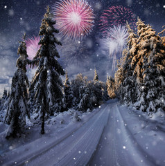 Wall Mural - starry sky in winter snowy night. fantastic milky way in the New Year's Eve. Winter road in the mountains. fireworks and holiday lights on the background. Photo greeting card