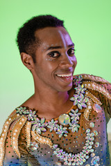 Face of african american man wearing costume. Colorful background. Carnival concept, funny and party. Carnaval Brazil.