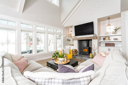 A Modern Farmhouse Family Room With Transom Windows And A