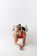 © alfa27 - blonde athlete is practicing press ups with elbows, full length shot, isolted white background.