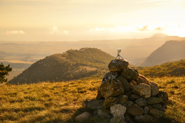 Poster - Action cameras mounted on a small tripod on top of a mountain