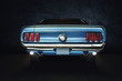 Leinwandbild Motiv Mustang Ford Oldtimer - classic Car (blaues Auto mit Hintergrund schwarz) Studio