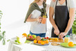 © alfa27 - Young couple dicing fruit in the kitchen. close up cropped photo