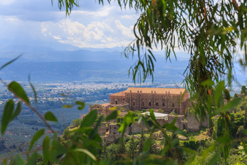 Wall Mural - distant view on Paleolog castle in Mystras against Laconia valley