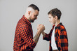 © alfa27 - young man is proud of his son. daddy helps to his son to overcome problems. belief in son. gorgeous father encourages his son to do something