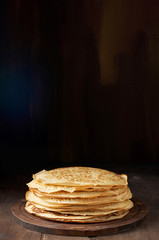 Wall Mural - Stack of russian pancake blini on a wooden background