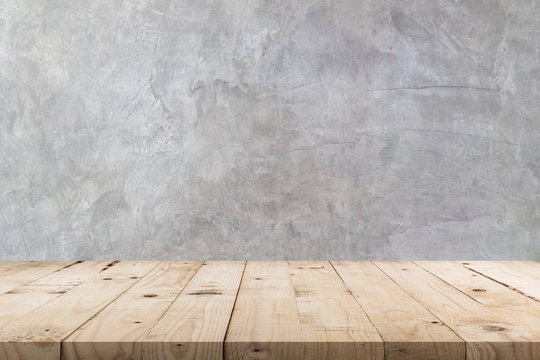 empty wooden table and concrete wall texture and background with copy space, display montage for pro
