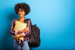 © paulovilela - young african student with backpack on the back on blue background