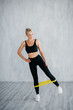 © MZaitsev - girl exercising pilates fitness elastic resistant band exercises
