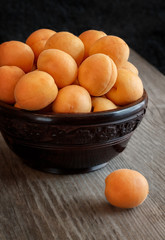 apricots in a vase on the table