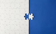 © Denis - White puzzles on a blue background with one missing piece