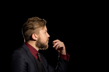 Wall Mural - image of a man with a beard on a black background