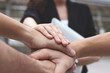 © tuaindeed - Business people stacking hands together. Successful and teamwork concept.