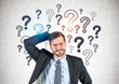 © ImageFlow - Confused businessman, question marks
