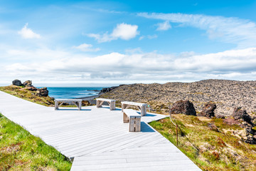 Wall Mural - Snaefellsjokull, Iceland national park with wooden boardwalk trail and nobody by Djupalonssandur Beach Hellnar