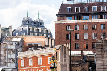 London, UK Cityscape skyline of Victoria old architecture brick office buildings and Little Ben Clock